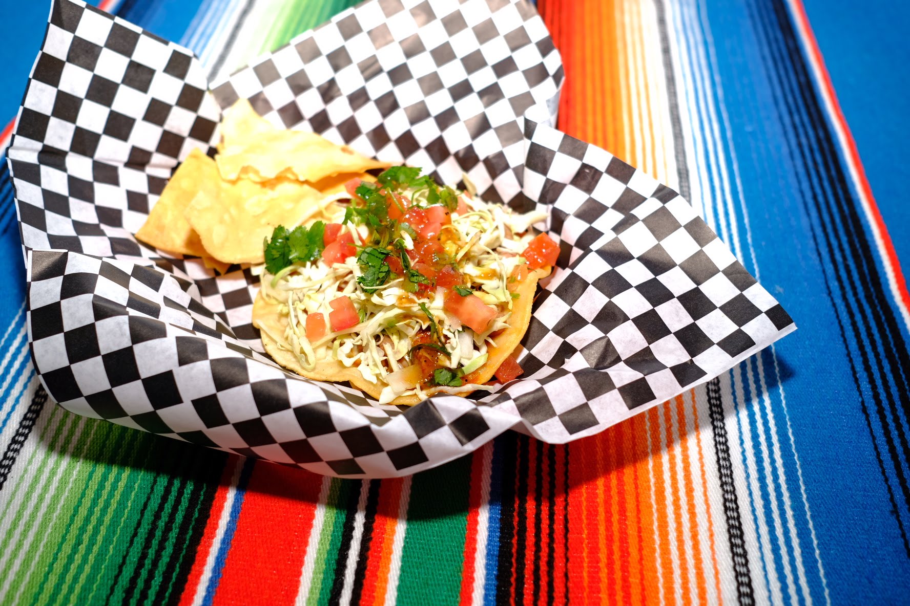 Fresh taco with cabbage, tomatoes and cilantro